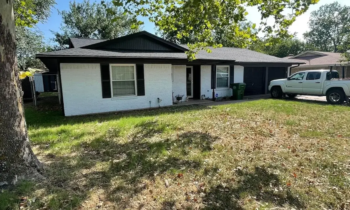 Professional roofing crew working on a residential roof in Shoreline